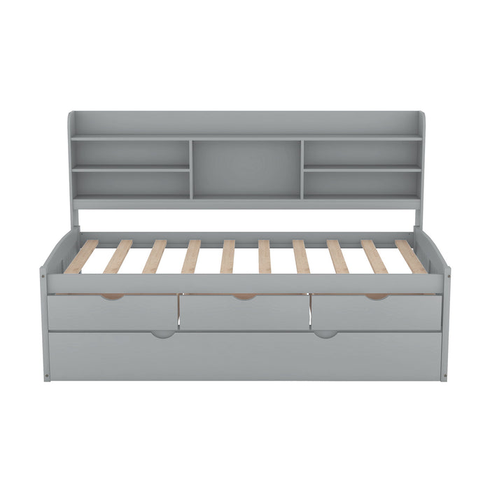Giga captain bed with built-in bookshelves, three storage drawers, and a trundle, showcasing the multi-functional design and sturdy frame.