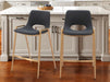 Set of two 26-inch black faux leather and gold steel low back counter height bar chairs by HomeRoots.