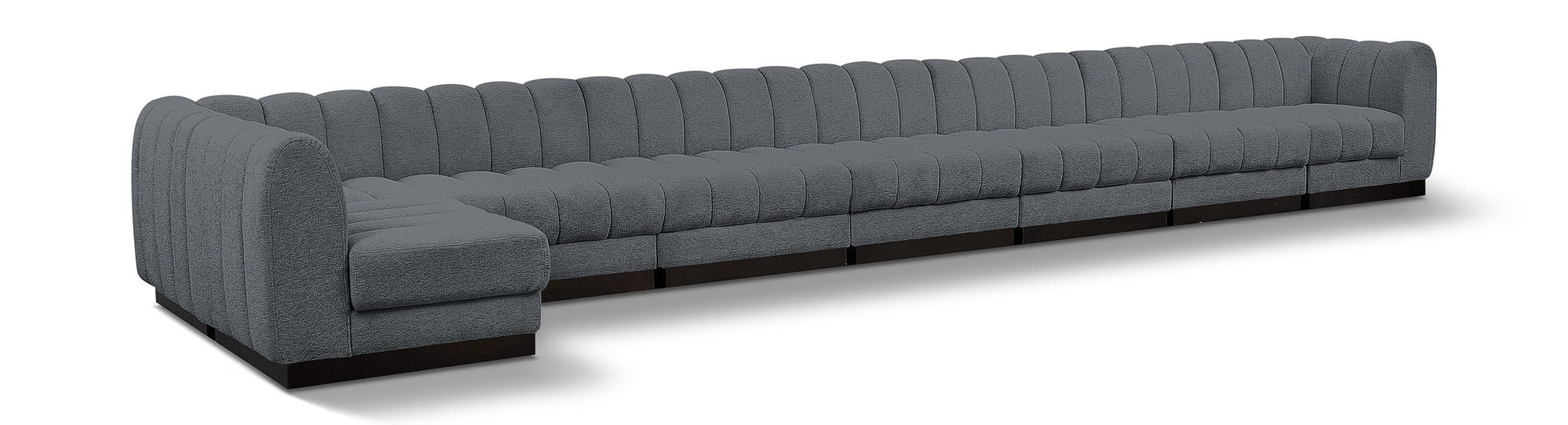 Meridian Furniture Quinn 8-piece modular sectional sofa with neutral fabric upholstery and customizable seating arrangement.