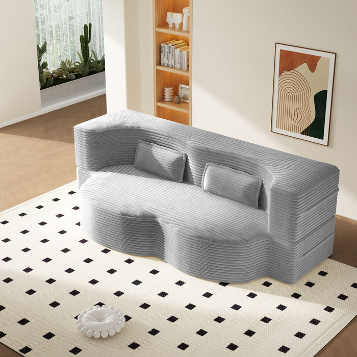 Giga floor sofa with two pillows and a convertible twin size mattress for living room seating and lounging.