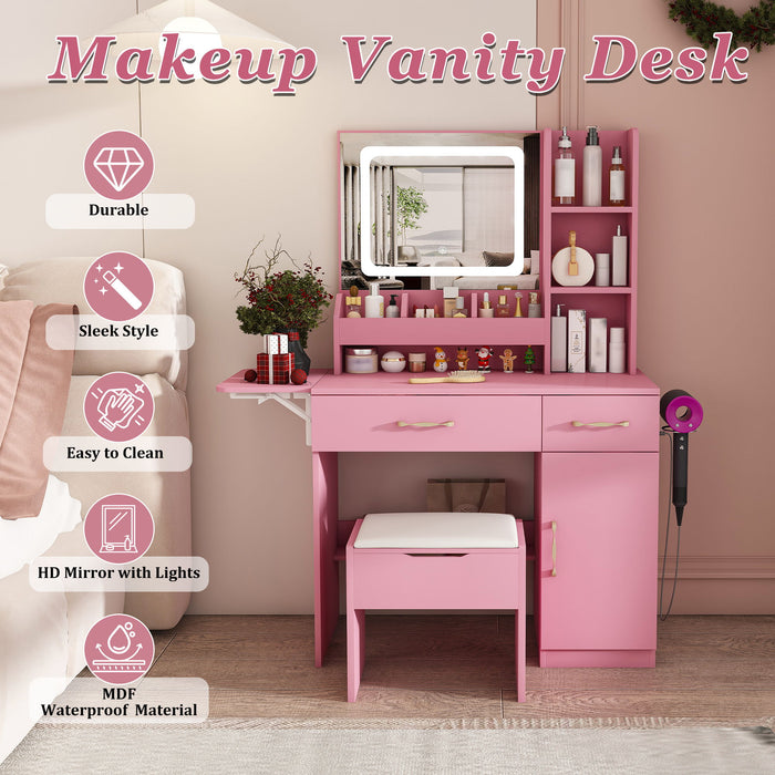 Pink Giga vanity desk set with LED mirror lights, 3 drawers, 7 shelves, and matching storage stool, featuring a power outlet charging station.