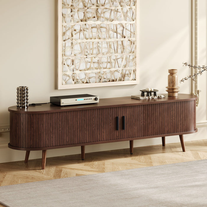 Dark brown Giga TV stand for 70-inch TVs with tambour doors, drawers, and built-in power outlet, showcasing sleek modern design.