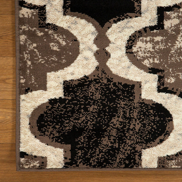 9' x 12' Quatrefoil Power Loom Distressed Stain Resistant Area Rug - Ivory
