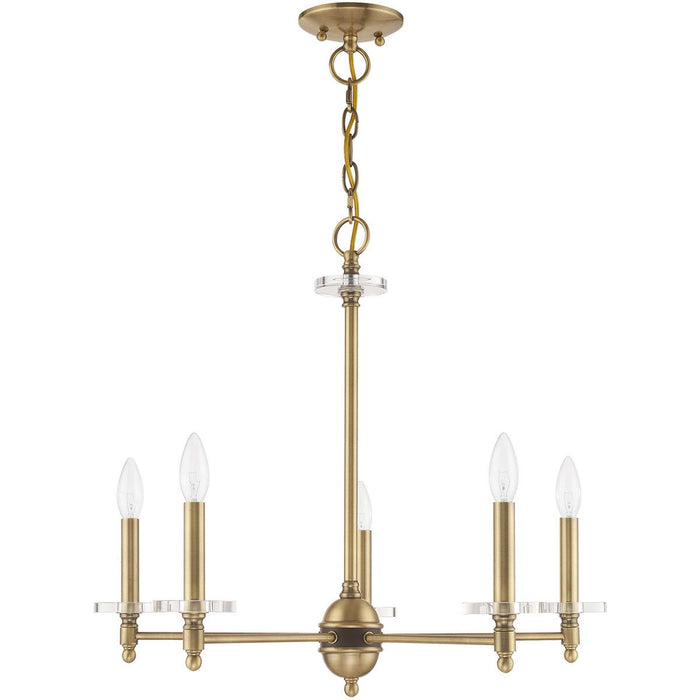 Five-light metal chandelier with shades in antiqued brass finish, featuring clear glass shades and dimmable lighting by HomeRoots.