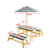 Giga Naturally Playful kids picnic table with blue and white striped umbrella, suitable for indoor and outdoor play.