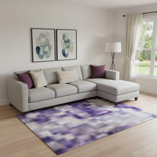 HomeRoots 10x14 abstract washable area rug with UV protection in purple, green, and ivory, showing vibrant colors and soft texture.