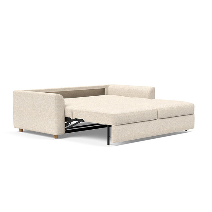 Innovation Living Neah king size sofa bed with curved arms, modern design, upholstered in fabric, shown in a well-lit living room setting.