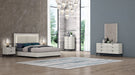 J & M Furniture Bella accent night stand with a sleek wooden finish and single drawer for modern bedroom storage.
