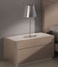 Left facing J & M Furniture Evora accent nightstand with a modern design, featuring a drawer and open storage compartment.