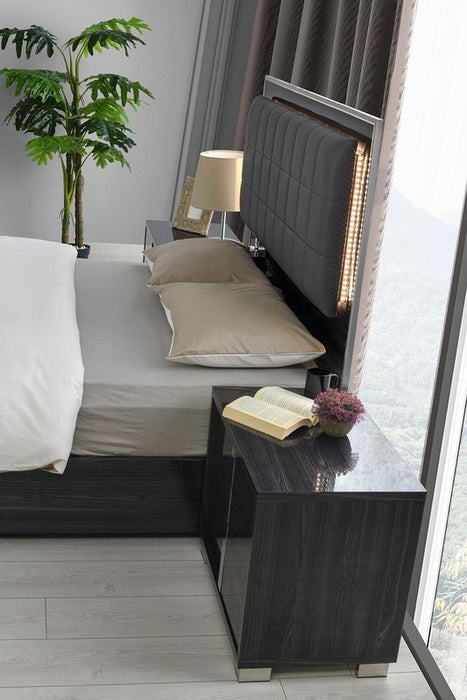 Glossy gray J & M Furniture Giulia nightstand with left-facing drawer, modern accent nightstand for bedroom decor.