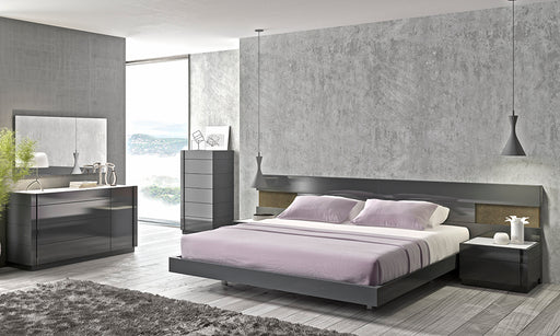 J & M Furniture Braga king size bed with a wooden frame and upholstered headboard in a modern bedroom setting.