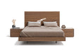 Walnut J & M Furniture Faro queen size bed with sleek wooden frame and modern design, shown in a well-lit bedroom setting.