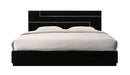 J & M Furniture Lucca full size bed with wooden frame and headboard, shown in a modern bedroom setting.