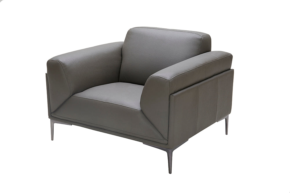 J & M Furniture king chair from chair set, upholstered in fabric with a tall back and armrests, in a neutral color.
