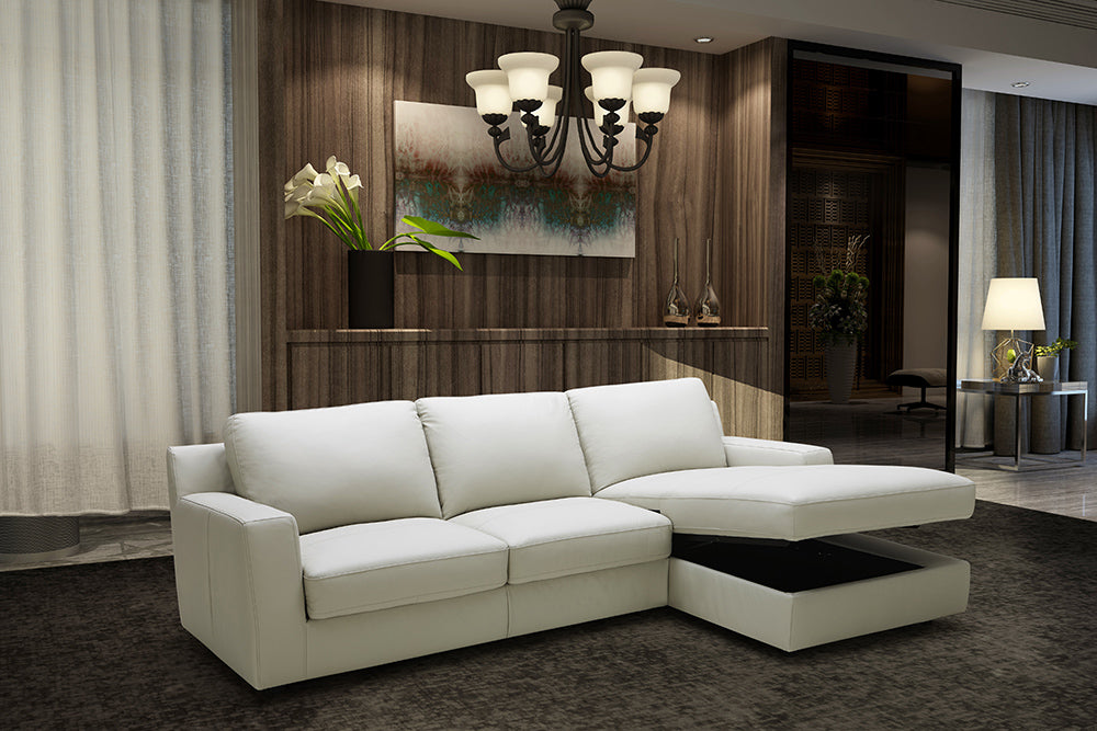 J&M Furniture Lauren Italian leather sectional sleeper sofa with right-facing chaise in light grey, showcasing plush seating and modern design.