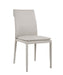 Light grey J & M Furniture Togo dining chair with sleek modern design, shown from the side.