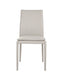 Light grey J & M Furniture Togo dining chair with a sleek, modern design, shown from the front view.