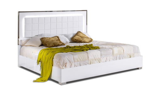 White high gloss king bed from J & M Furniture with a sleek headboard and modern design, shown in a spacious bedroom setting.
