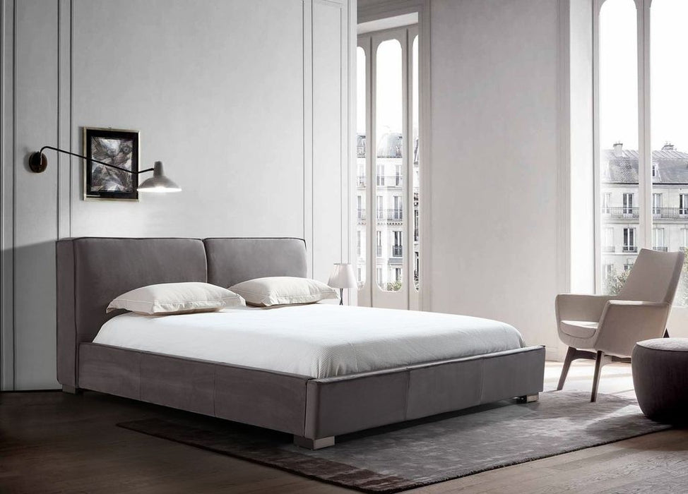 Grey J & M Furniture Serene King Bed with upholstered headboard and modern design, shown in a bedroom setting.