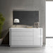 J & M Furniture Amora mirror with a sleek, modern frame, reflecting a stylish interior decor.