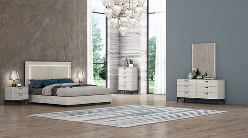 J & M Furniture Bella Mirror with a sleek rectangular frame, reflecting a modern room decor.