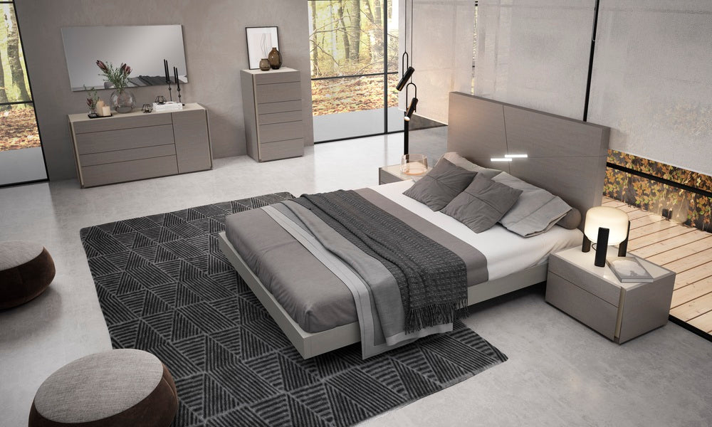 Grey J & M Furniture Faro Mirror with a sleek, modern frame, hanging on a wall in a contemporary interior setting.