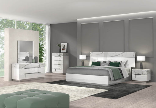 J & M Furniture Porto mirror with walnut wood frame, reflecting a modern design and clean lines in a stylish home decor setting.