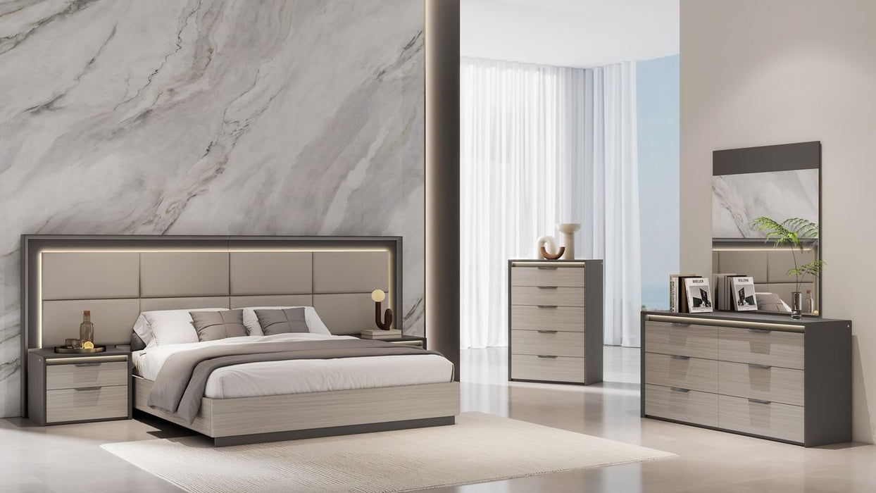 Grey J & M Furniture Muse Queen Bed with upholstered headboard and modern design, shown in a stylish bedroom setting.