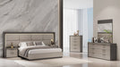 Grey J & M Furniture Muse Queen Bed with upholstered headboard and modern design, shown in a stylish bedroom setting.