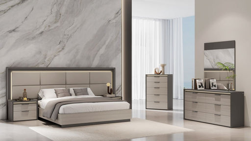 Grey J & M Furniture Muse Queen Bed with upholstered headboard and modern design, shown in a stylish bedroom setting.