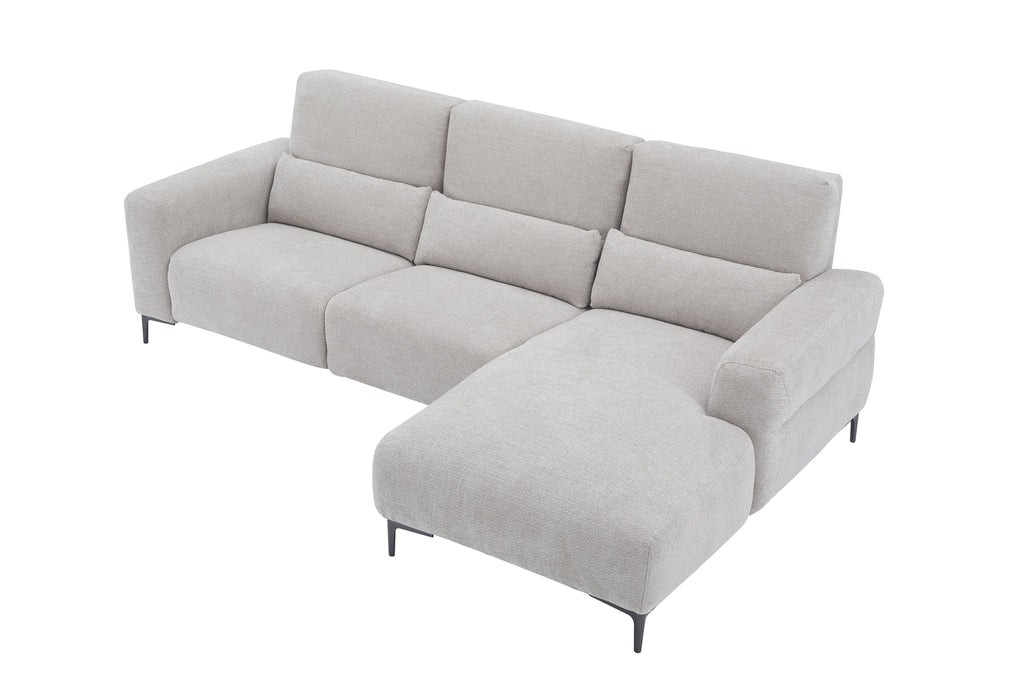 Light gray J & M Furniture Winslow fabric sectional with a chaise, showcasing plush cushions and contemporary design.