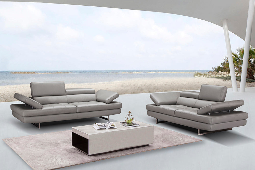 J & M Furniture Aurora stationary loveseat with plush fabric and cushioned armrests, ideal for cozy living room seating.