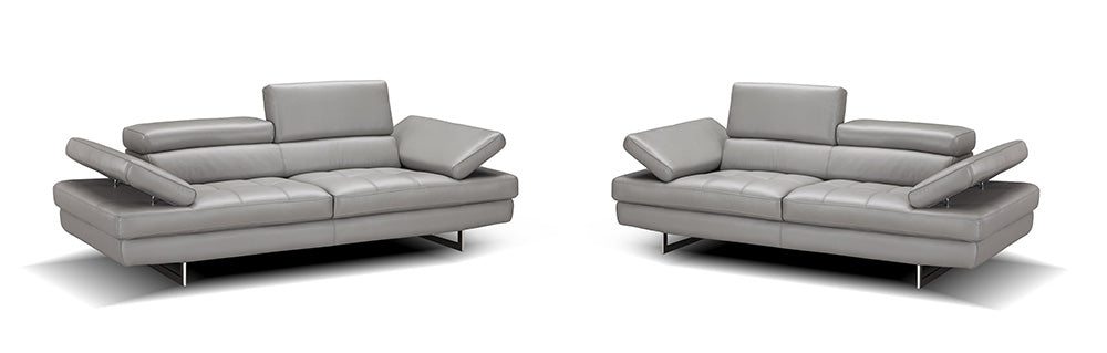 J & M Furniture Aurora Stationary Sofa in a neutral fabric with plush cushions and sleek armrests, perfect for modern living rooms.