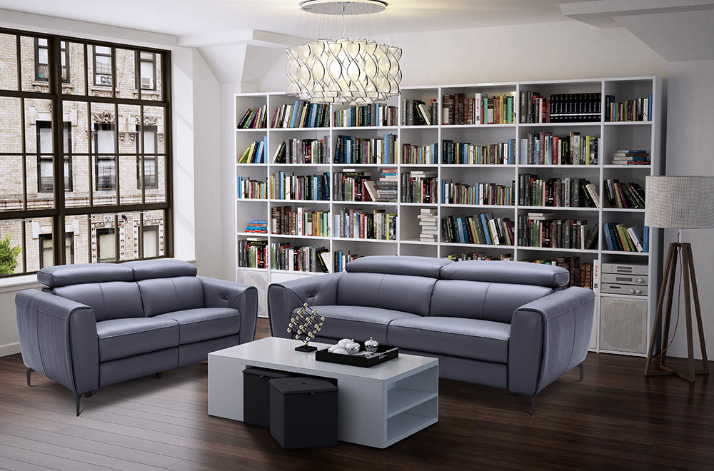 Blue grey J & M Furniture Lorenzo stationary sofa with plush cushions and modern design, perfect for living room decor.
