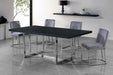 Pair of Meridian Furniture Heidi dining chairs in a set, featuring modern design with wooden legs and upholstered seats.