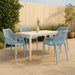 Set of two Meridian Furniture Mykonos outdoor dining chairs with woven seats and metal frames, ideal for patio or garden dining.