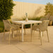 Set of two Meridian Furniture Mykonos outdoor dining chairs with woven seats and metal frames, perfect for patio or garden dining.
