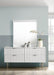 Modernist dresser by Meridian Furniture featuring sleek wood finish and minimalist design with multiple drawers for storage.