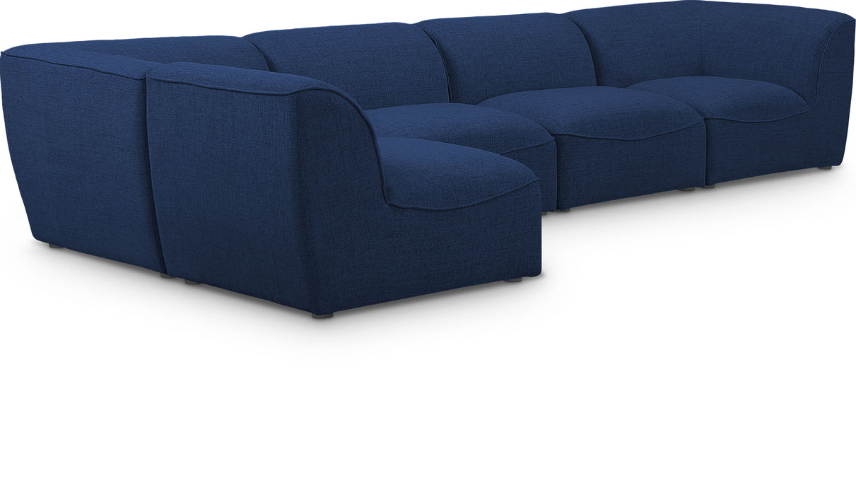 Miramar Meridian Furniture 5-piece modular sectional sofa with plush cushions and modern design, arranged in a spacious living room setting.