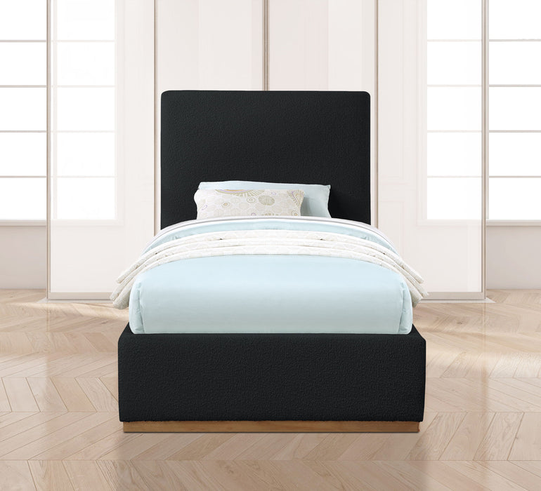 Upholstered Monaco bed by Meridian Furniture with a plush fabric headboard and a modern design in a bedroom setting.
