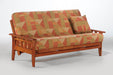 Night & Day Furniture Kingston Moonglider futon frame in cherry finish, showing the armrest and sturdy wooden construction.