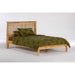Night & Day Furniture Solstice full platform bed with clean lines and wooden finish, shown in a modern bedroom setting.