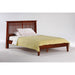 Night & Day Furniture Solstice Queen Platform Bed with sleek wooden frame and modern design, shown in a well-lit bedroom setting.