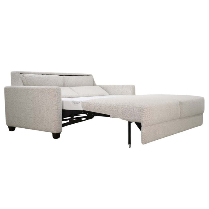 Omnia Leather Slofa Karma sleeper sofa with modern design, featuring a fold-out bed and plush upholstery in a stylish living room setting.
