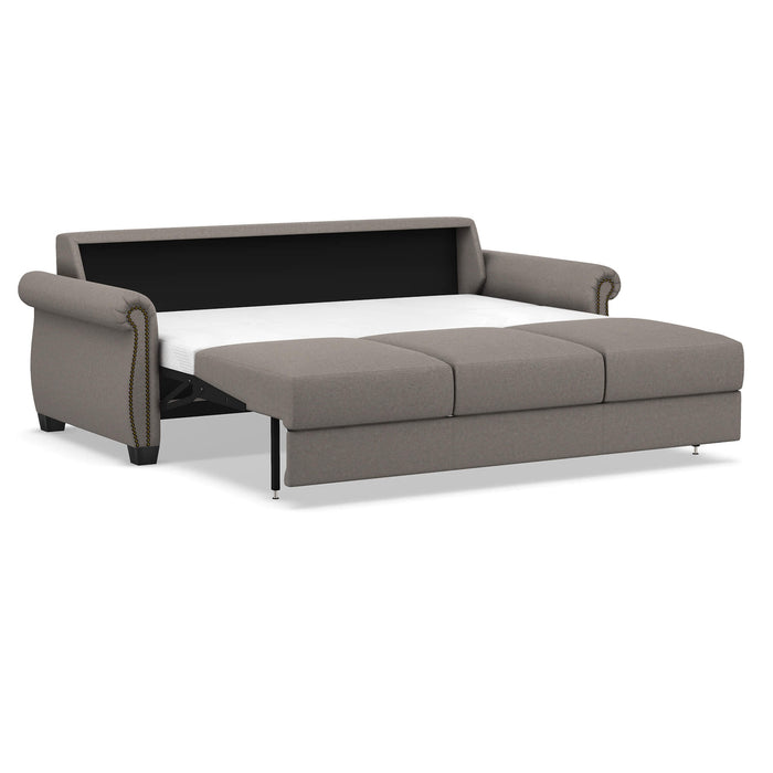 Slofa The Oasis sleeper sofa by Omnia Leather with plush cushions and modern design, shown in a stylish living room setting.