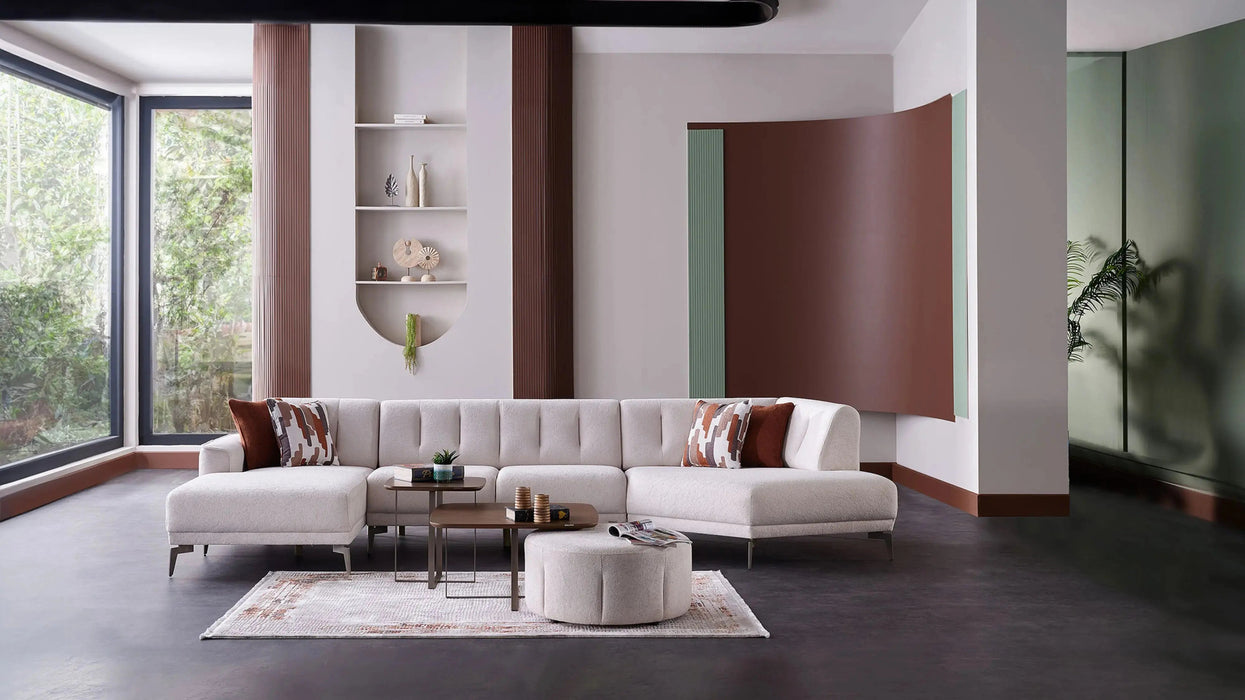 Bellona Atlanta sectional sofa with plush cushions and modern design, featuring neutral fabric upholstery and multiple seating sections.